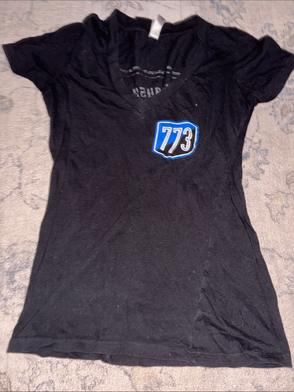 Next Level Apparel Black V-Neck Tee with Blue 773 Patch